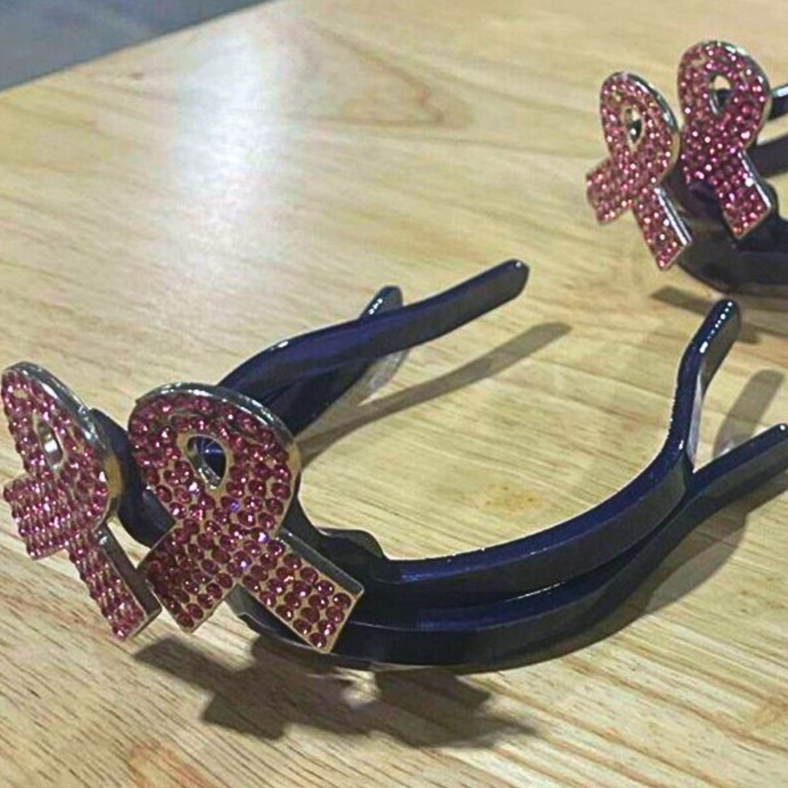Breast Cancer Ribbon Cowgirl Cuff handcrafted western boot accessory featuring pink rhinestone awareness ribbons on a black cuff designed to keep jean hems off the ground while adding western style to cowboy boots.