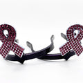 Breast cancer awareness ribbon Cowgirl Cuff featuring pink rhinestones and silver-tone detailing. Handcrafted western boot accessory designed to keep jean hems off the ground.