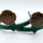 Front view of Celtic Cross Cowgirl Cuff showcasing intricate knotwork cross motif and antique copper finish on handcrafted western boot accessory.