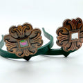 Copper flower Cowgirl Cuff featuring engraved western floral detailing and an iridescent translucent center stone, handcrafted boot accessory designed for cowboy boots and jean hem protection.