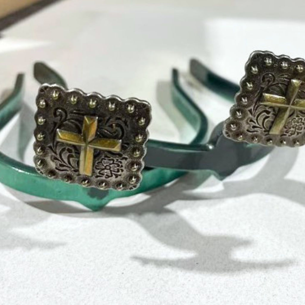 Cross Berry Square Cowgirl Cuff featuring a raised copper-tone cross, western scroll engraving, and berry-edge concho details on a green cuff base.