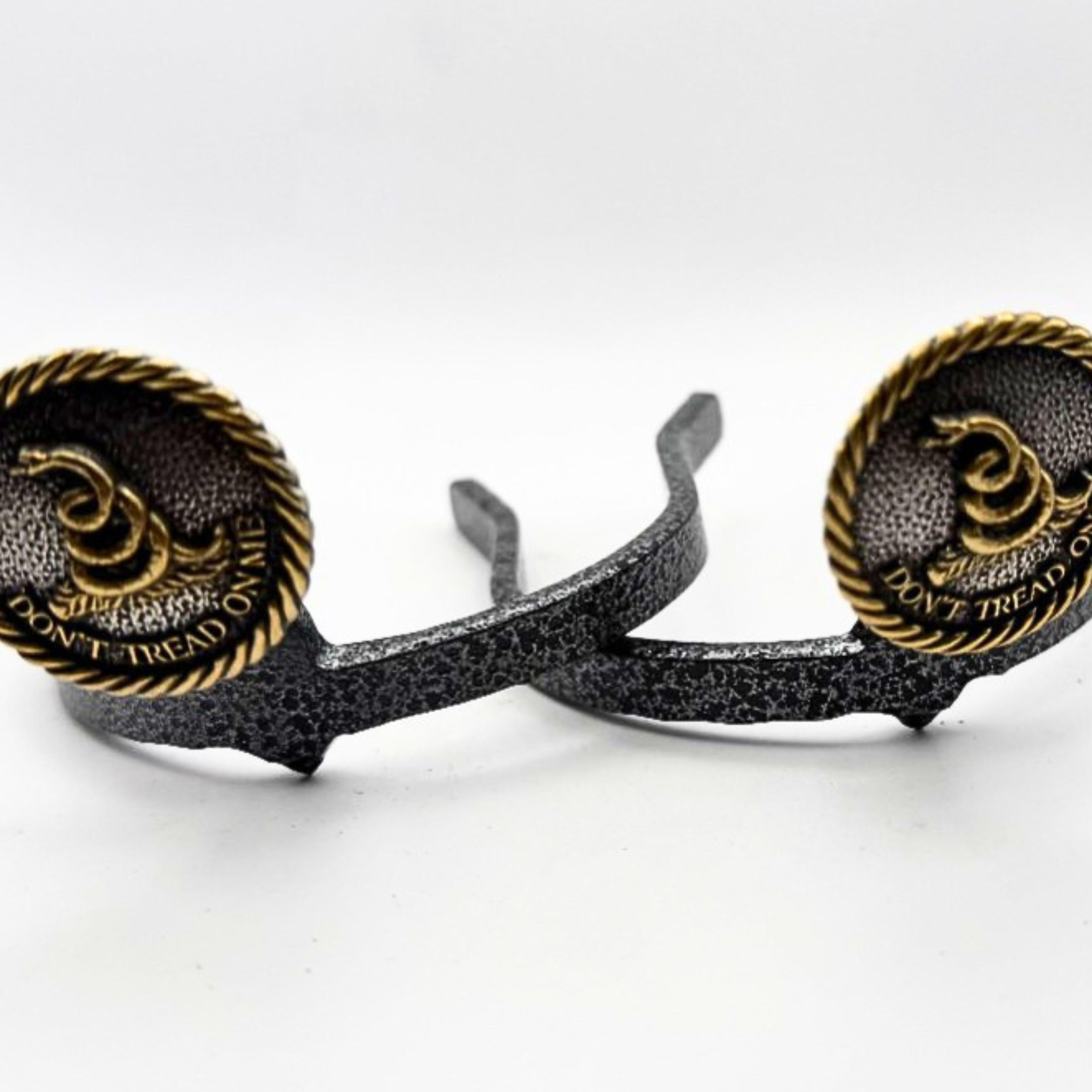 Don't Tread on Me Cowgirl Cuff featuring a gold-tone rattlesnake emblem and rope-edge border. Handcrafted western boot accessory designed to keep jean hems off the ground.