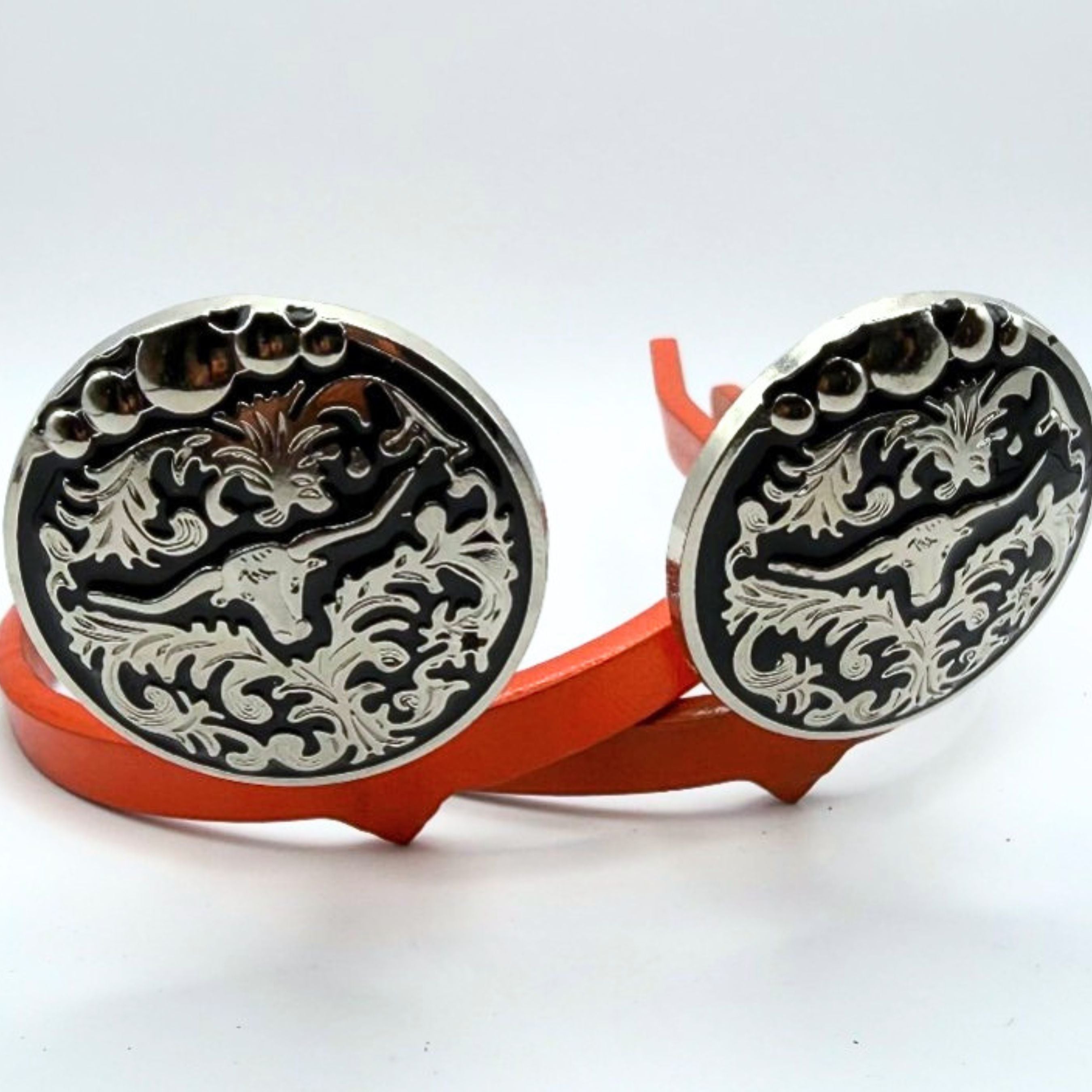 Handcrafted Ebony Longhorn Cowgirl Cuff featuring a silver longhorn design, black enamel background, and western scrollwork detailing on a handcrafted boot accessory.