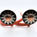 Here Comes the Sun Cowgirl Cuff featuring a silver sunburst design with a copper center on a handcrafted western boot accessory designed to keep jean hems off the ground while adding feminine western style.
