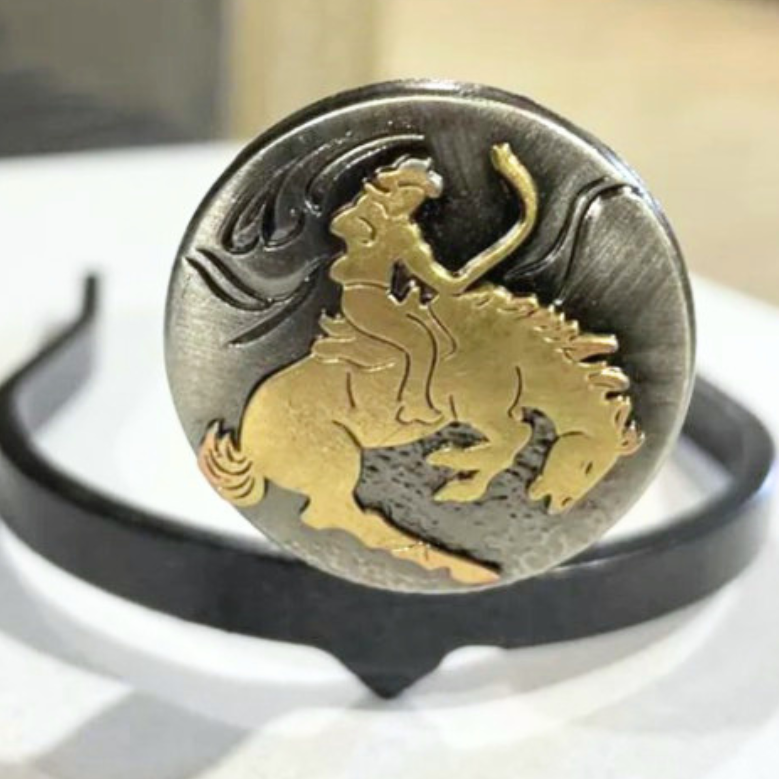 Handcrafted Horse Rider Cowgirl Cuff featuring a rodeo rider on a bucking horse with western styling and jean hem protection for cowboy boots.