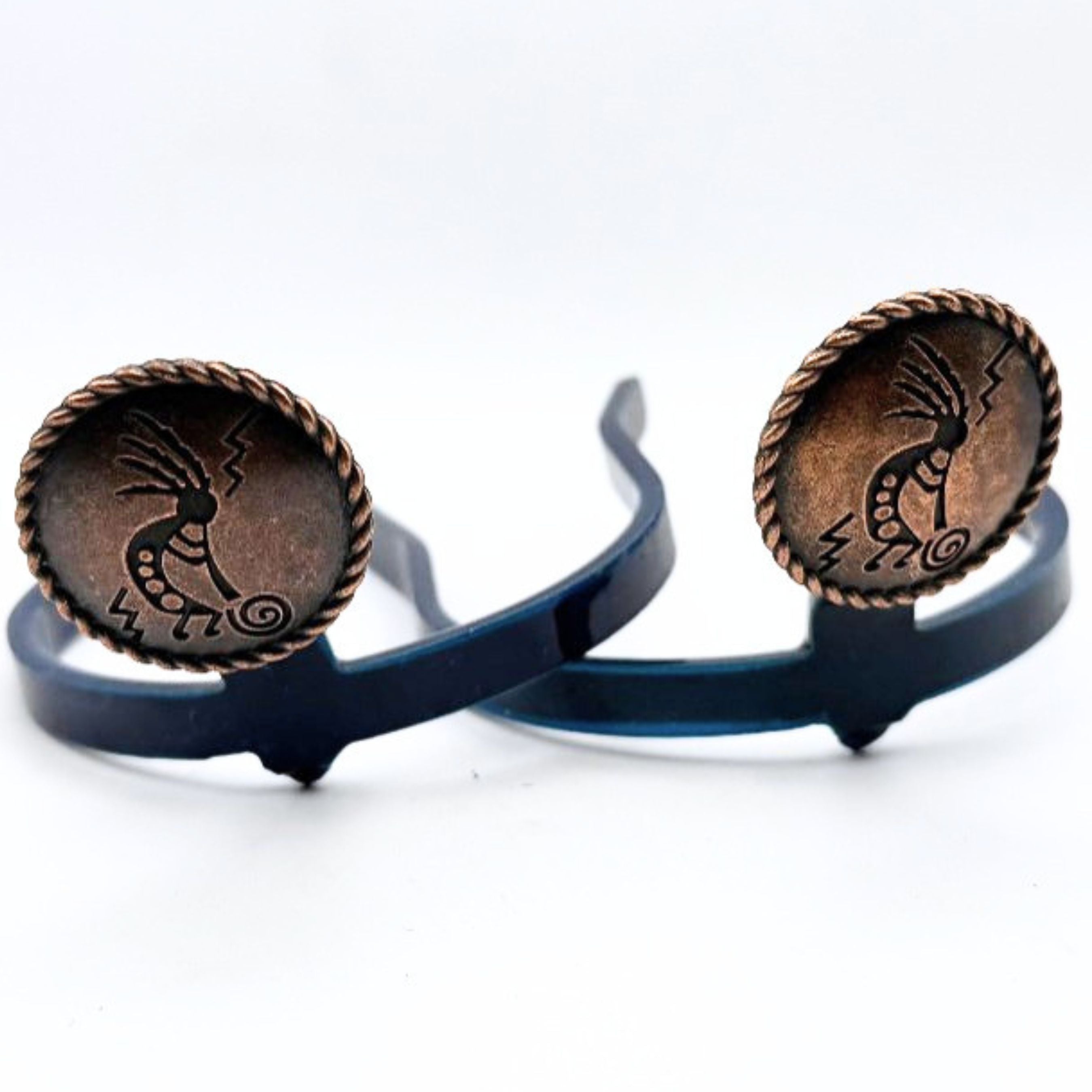 Kokopelli Cowgirl Cuff featuring an engraved Kokopelli design on antique copper conchos with rope-edge detailing, handcrafted as a western boot accessory that helps keep jean hems off the ground.
