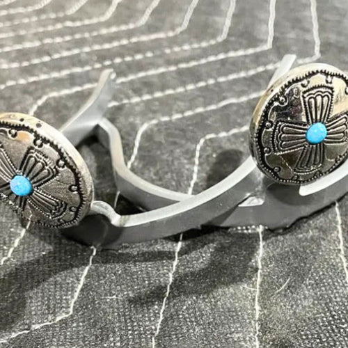 Handcrafted Navajo cross Cowgirl Cuff featuring silver-tone western conchos with turquoise stone accents, designed to attach to cowboy boots and help keep jean hems off the ground.
