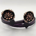 Handcrafted Oaxaca Floral Concho Cowgirl Cuff featuring copper-tone floral details, black enamel background, silver-tone beaded border, and southwestern western boot accessory styling.