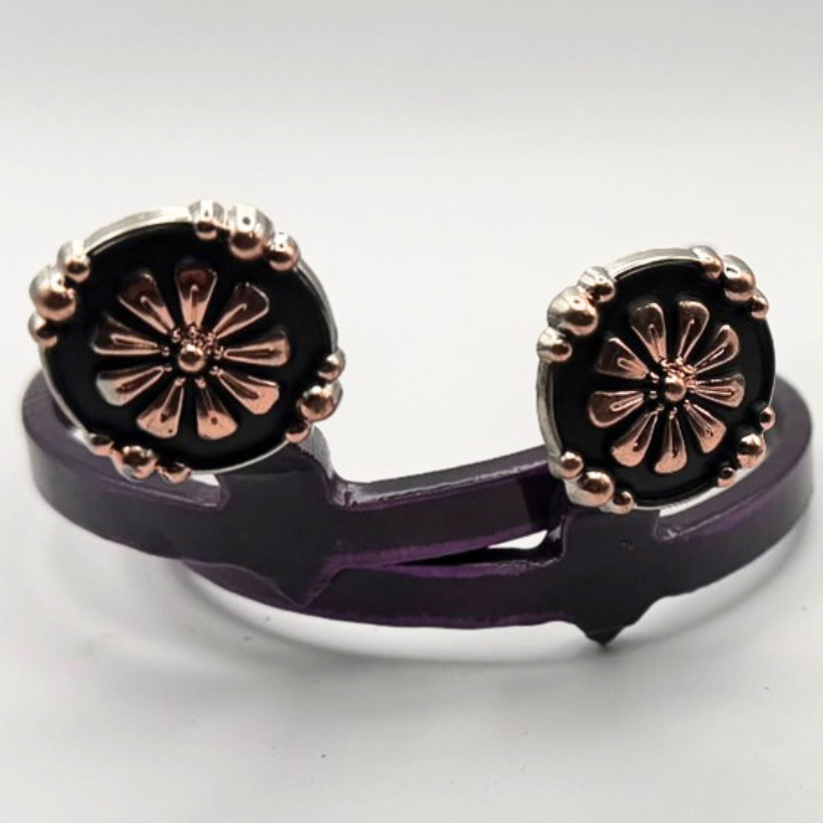 Handcrafted Oaxaca Floral Concho Cowgirl Cuff featuring copper-tone floral details, black enamel background, silver-tone beaded border, and southwestern western boot accessory styling.