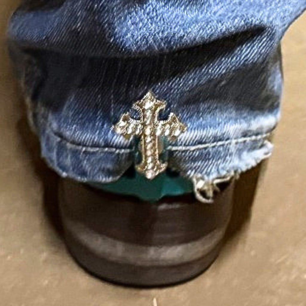 Rhinestone Cross Cowgirl Cuff attached to a cowboy boot helping keep jean hems off the ground while adding faith-inspired western style and crystal accents.