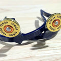 Handcrafted Shotgun Shell Cowgirl Cuff featuring 12 gauge shotgun shell-inspired accents, blue metal finish, and western styling designed for cowboy boots and jean hem protection.