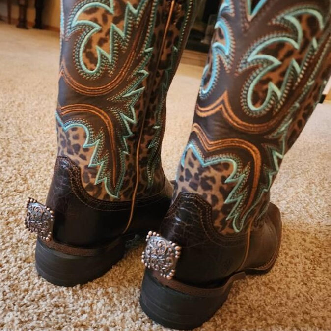 Customer review photo showing the Yuma Square Cowgirl Cuff attached to leopard print cowboy boots, helping lift jean hems while adding handcrafted western style and personality.